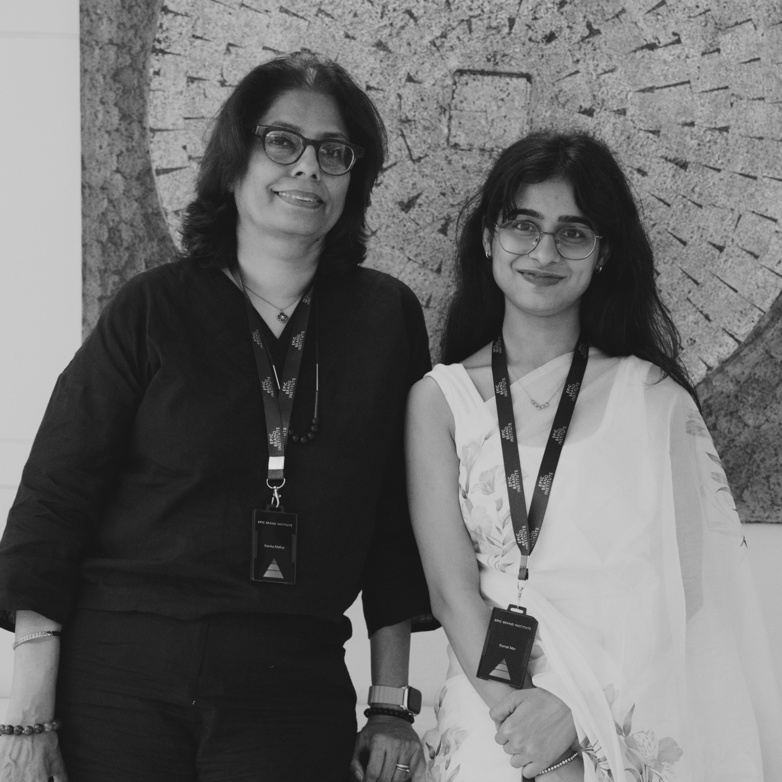 2 women leaders standing and smiling