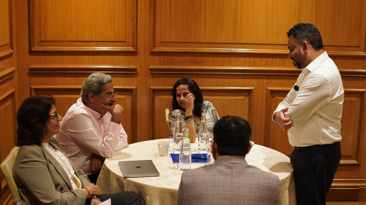 Business leaders discussing strategy around a meeting table